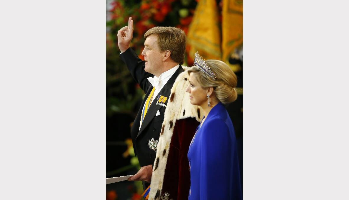 ng Willem Alexander of the Netherlands takes an oath as he stands alongside Queen Maxima of the Netherlands during his inauguration in front of a joint session of the two houses of the States General at Nieuwe Kerk