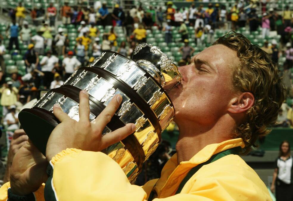 2003: Lleyton Hewitt of Australia kisses the trophy after Australia defeated Spain in the Davis Cup Final. Photo by Mark Dadswell/Getty Images