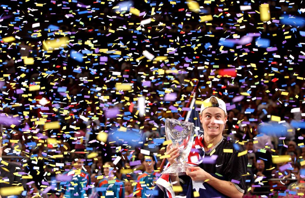 2001: Lleyton Hewitt celebrates his victory over Sabastien Grosjean of France with the Championship trophy after the Final of the Tennis Masters Cup in 2001. Photo: Nick Laham/ALLSPORT