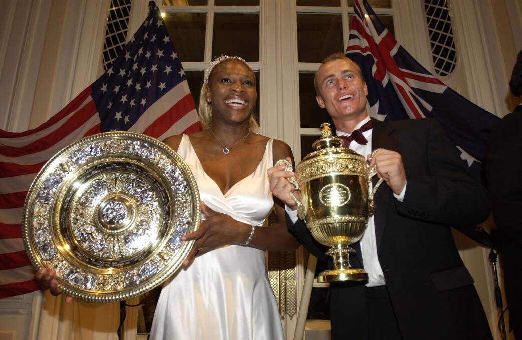Wimbledon Champions Lleyton Hewitt of Australia and Serena Williams of the U.S. pose with their trophies. Photo by Clive Brunskill/Getty Images