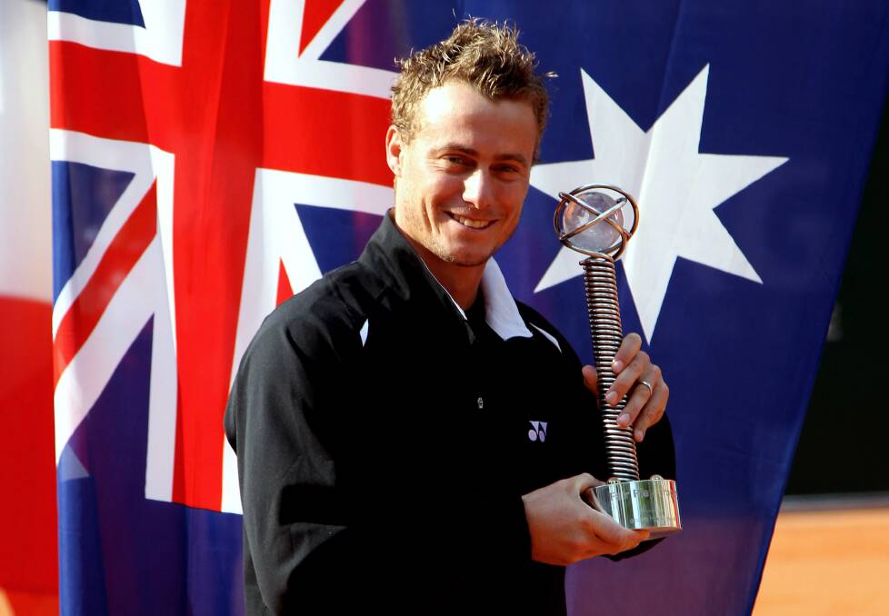 2010: Lleyton Hewitt of Australia receives the fair play trophy during day three of the ARAG World Team Cup. Photo by Friedemann Vogel/Bongarts/Getty Images