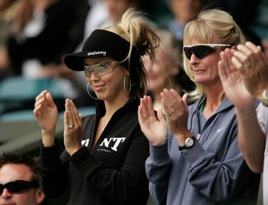 2005: Cherilyn Hewitt, Lleyton's mother (R), and Bec Cartwright, his now wife, watch his match against Roger Federer during the eleventh day of the Wimbledon Lawn Tennis Championship. Photo by Clive Brunskill/Getty Images