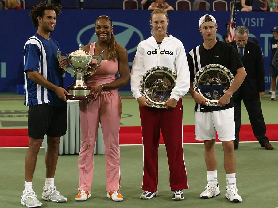 2003: James Blake and Serena Williams of the USA and Lleyton Hewitt and Alicia Molik of Australia pose for photographers after the 2002/2003 Hyundai Hopman Cup. Photo by Sean Garnsworthy/Getty Images
